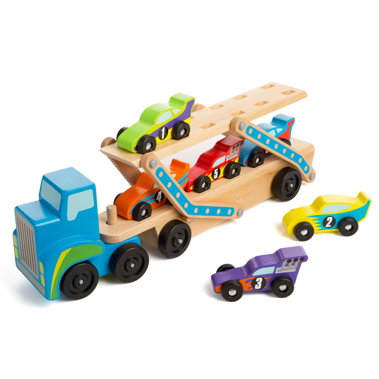 An assembled or decorated The Melissa & Doug Mega Race-Car Carrier - Wooden Tractor and Trailer With 6 Unique Race Cars