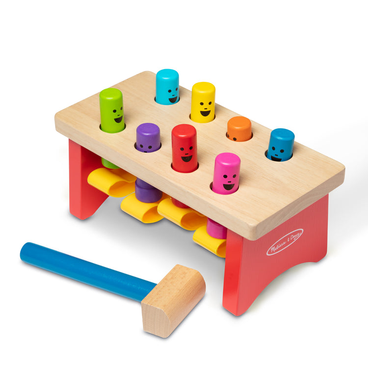 The loose pieces of The Melissa & Doug Deluxe Pounding Bench Wooden Preschool Learning Toy With Mallet