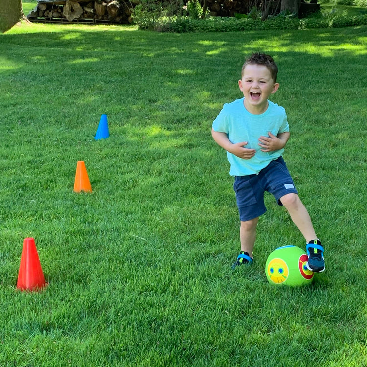 A kid playing with the Melissa & Doug 8 Activity Cones - Set of 8