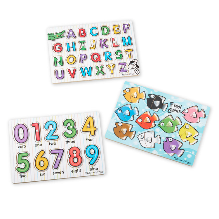 The loose pieces of the Melissa & Doug Classic Wooden Peg Puzzles (Set of 3) - Numbers, Alphabet, and Colors