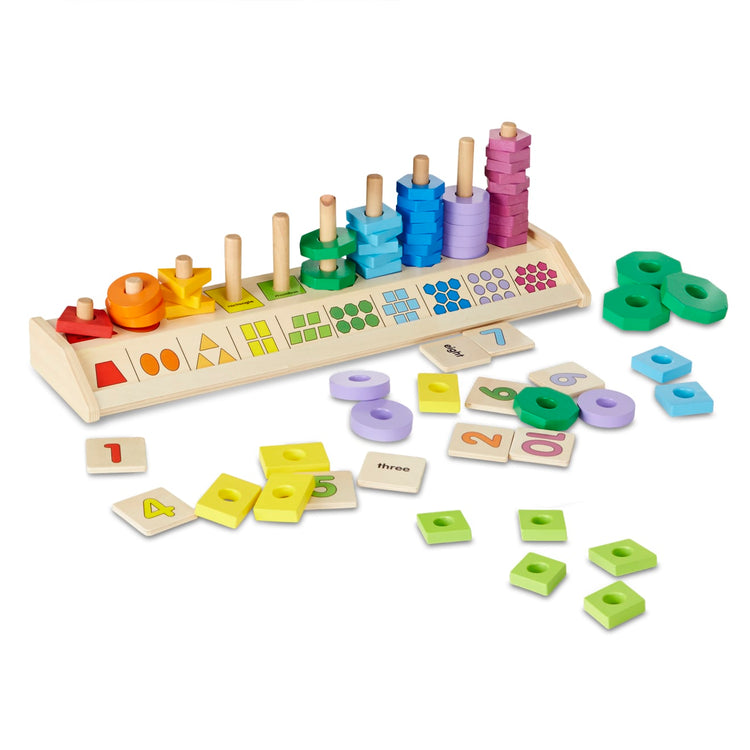 The loose pieces of the Melissa & Doug Counting Shape Stacker - Wooden Educational Toy With 55 Shapes and 10 Number Tiles