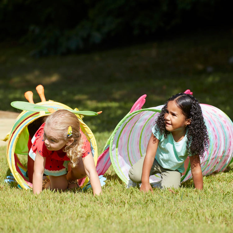 A kid playing with the Melissa & Doug Sunny Patch Cutie Pie Butterfly Crawl-Through Tunnel (almost 5 feet long)