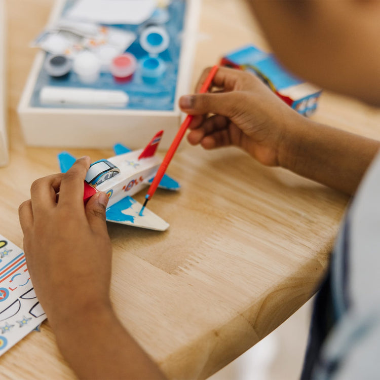 The front of the box for the Melissa & Doug Decorate-Your-Own Wooden Plane Craft Kit