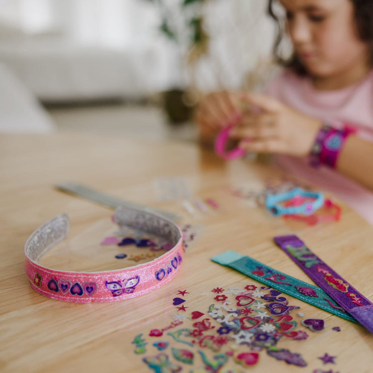 The front of the box for the Melissa & Doug Design-Your-Own Headbands Jewelry-Making Kit With 50+ Stickers