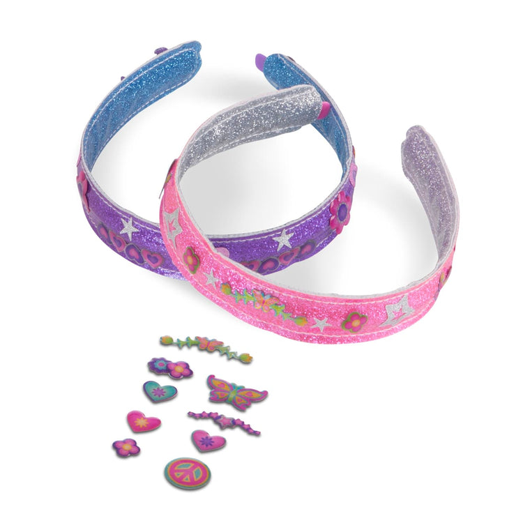 The loose pieces of the Melissa & Doug Design-Your-Own Headbands Jewelry-Making Kit With 50+ Stickers