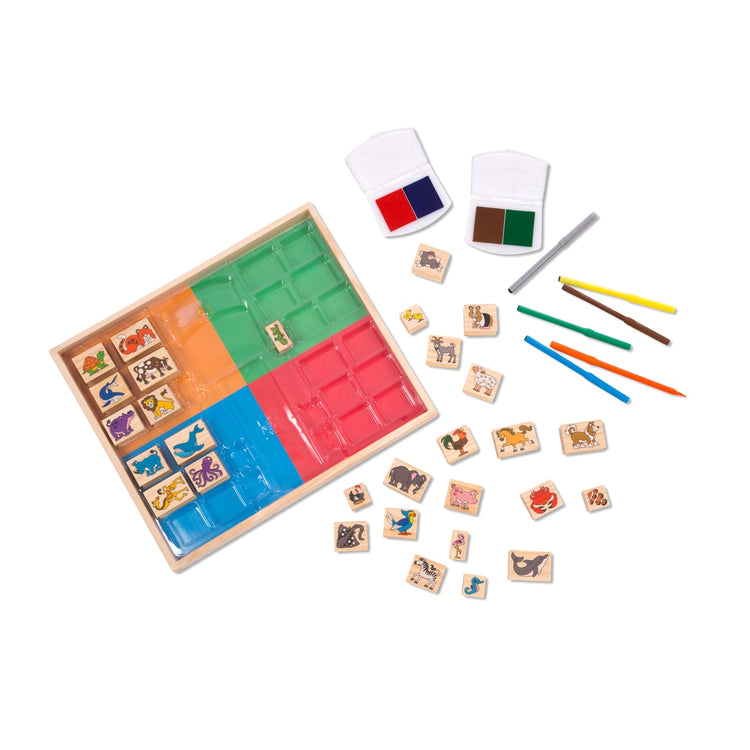 The loose pieces of the Melissa & Doug Deluxe Wooden Stamp Set: Animals - 30 Stamps, 6 Markers, 2 Stamp Pads