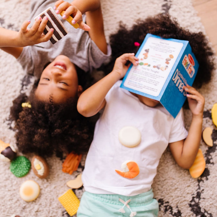 A kid playing with the Food Fun Combine & Dine Dinners - Blue