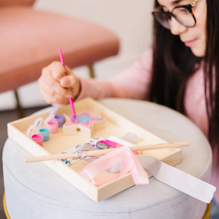 The front of the box for the Melissa & Doug Decorate-Your-Own Wooden Princess Wand Craft Kit