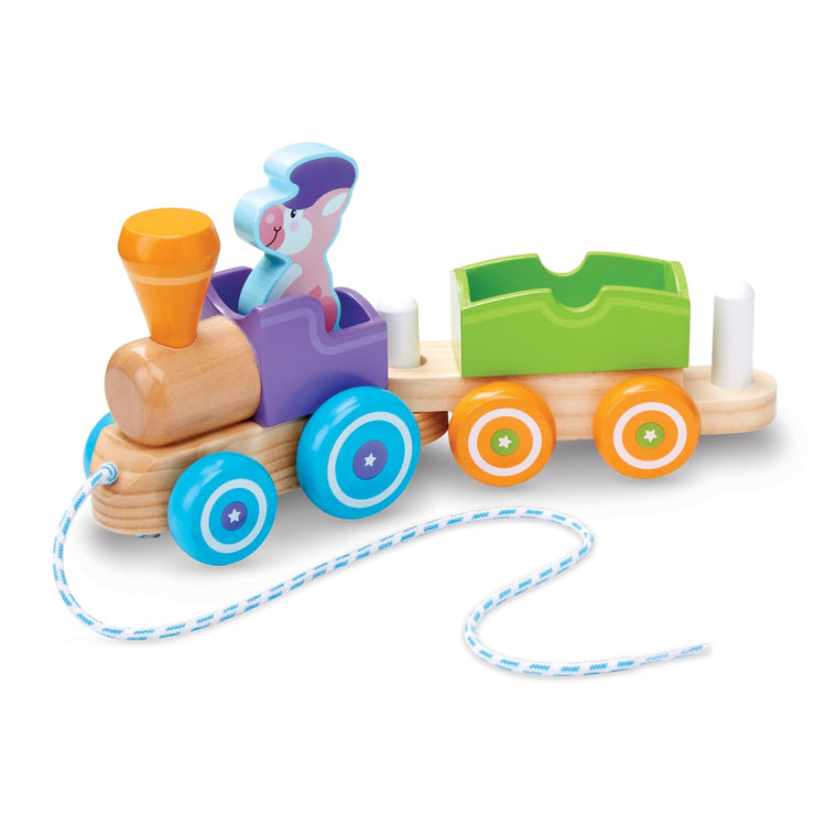 The loose pieces of the Melissa & Doug First Play Wooden Rocking Farm Animals Pull Train