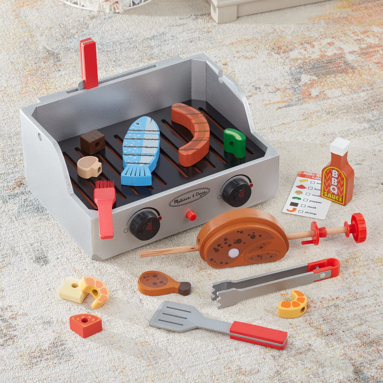 the Melissa & Doug Rotisserie and Grill Wooden Barbecue Play Food Set (24 pcs)