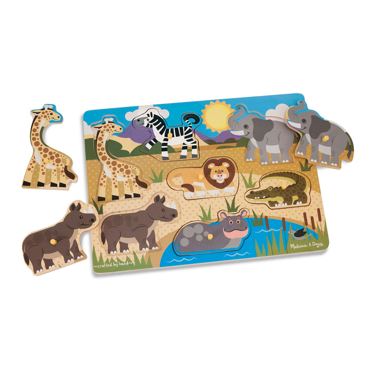 The loose pieces of the Melissa & Doug Safari Wooden Peg Puzzle (7 pcs)