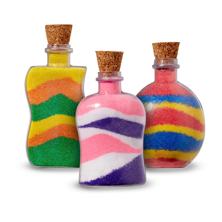 The front of the box for the Melissa & Doug Created by Me! Sand Art Bottles Craft Kit: 3 Bottles, 6 Bags of Colored Sand, Design Tool