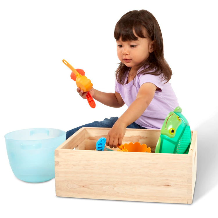 A child on white background with the Seaside Sidekicks Sand Baking Set