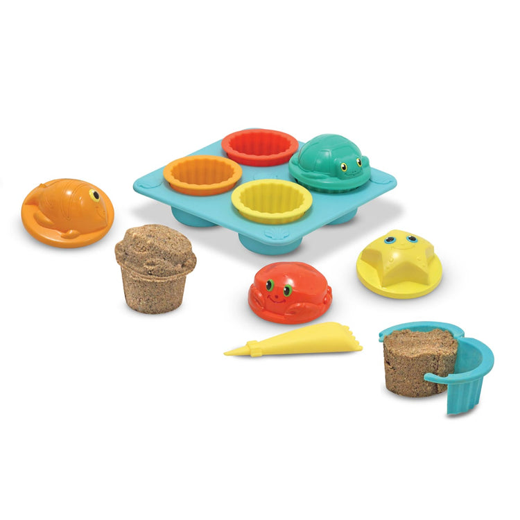 The loose pieces of the Melissa & Doug Sunny Patch Seaside Sidekicks Sand Cupcake Play Set