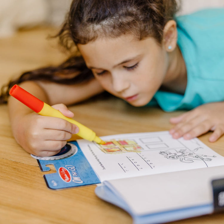 The front of the box for the Melissa & Doug On the Go Spy Mystery Secret Decoder Book With Decoder Wheel and Magic-Reveal Pen