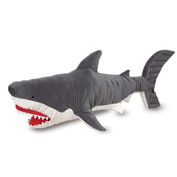 T child on white background with the Melissa & Doug Giant Shark - Lifelike Stuffed Animal (over 3 feet long)