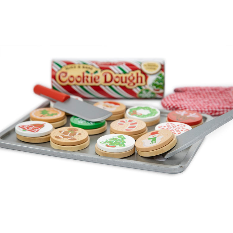 The loose pieces of the Melissa & Doug Slice and Bake Wooden Christmas Cookie Play Food Set