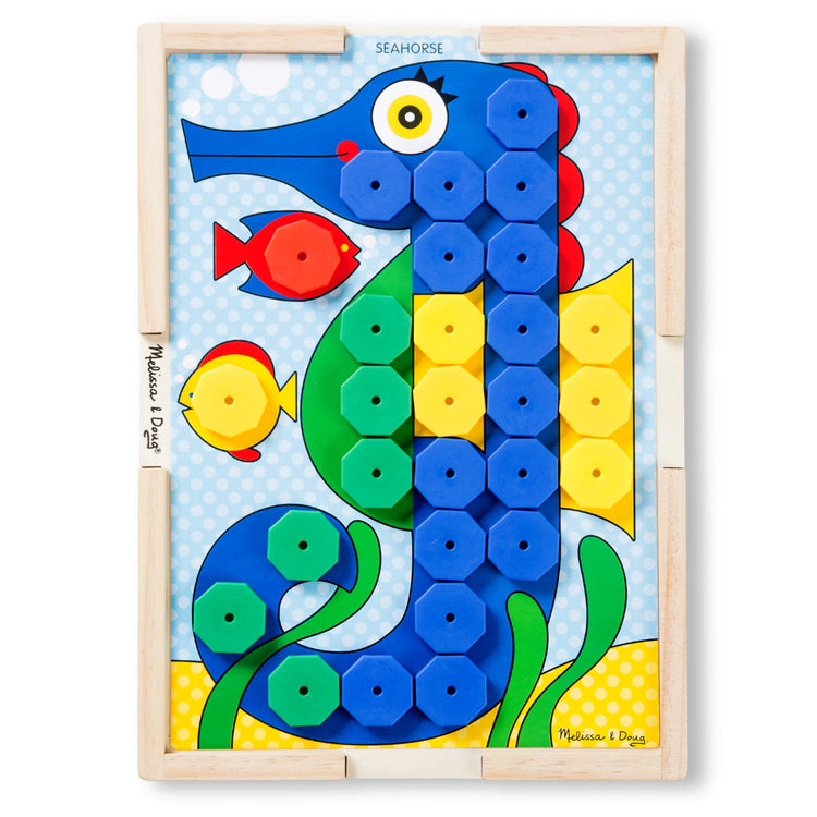 The loose pieces of the Melissa & Doug Sort and Snap Color Match - Sorting and Patterns Educational Toy