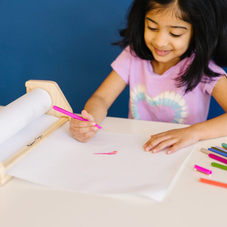 The front of the box for the Melissa & Doug Wooden Tabletop Paper Roll Dispenser With White Bond Paper (12 inches x 75 feet)