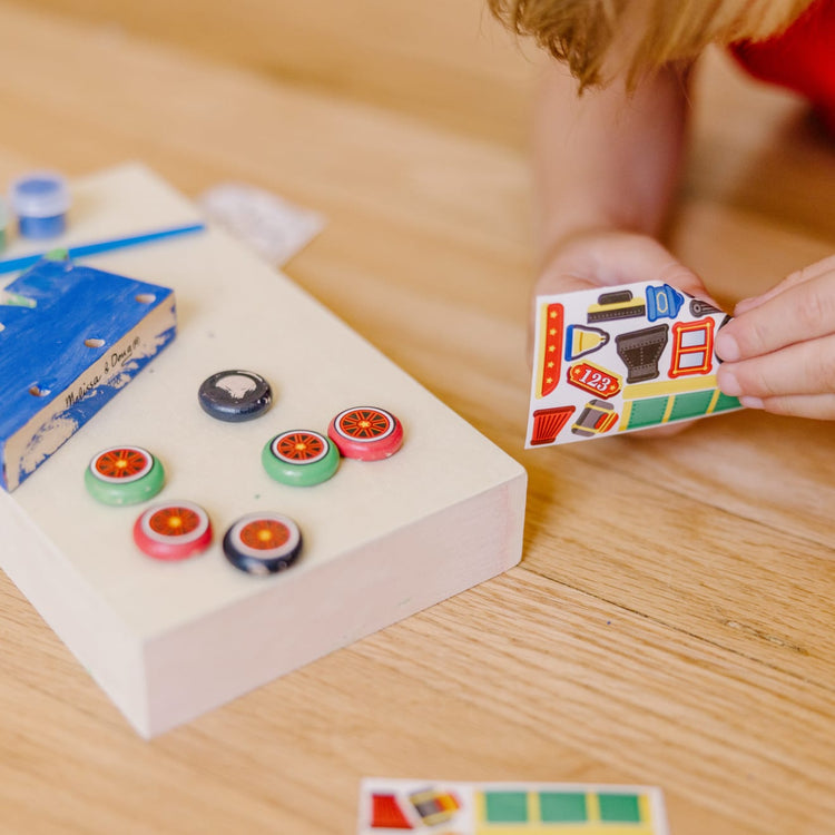 The front of the box for the Melissa & Doug Train Wooden Craft Kit