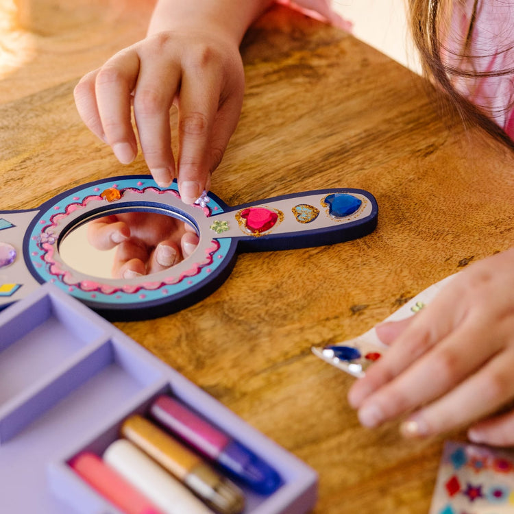 The front of the box for the Melissa & Doug Decorate-Your-Own Wooden Princess Mirror Craft Kit