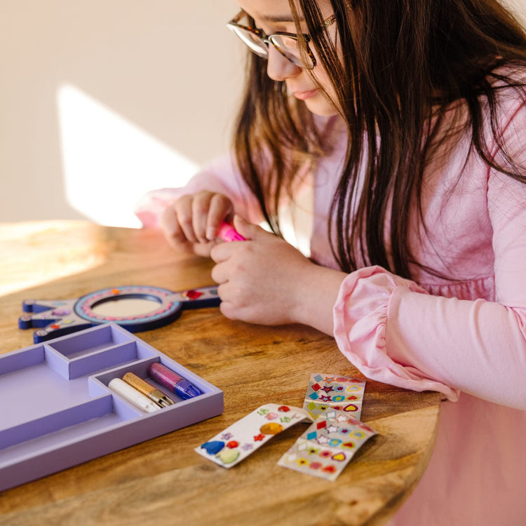 The front of the box for the Melissa & Doug Decorate-Your-Own Wooden Princess Mirror Craft Kit