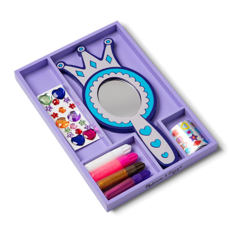 The loose pieces of the Melissa & Doug Decorate-Your-Own Wooden Princess Mirror Craft Kit